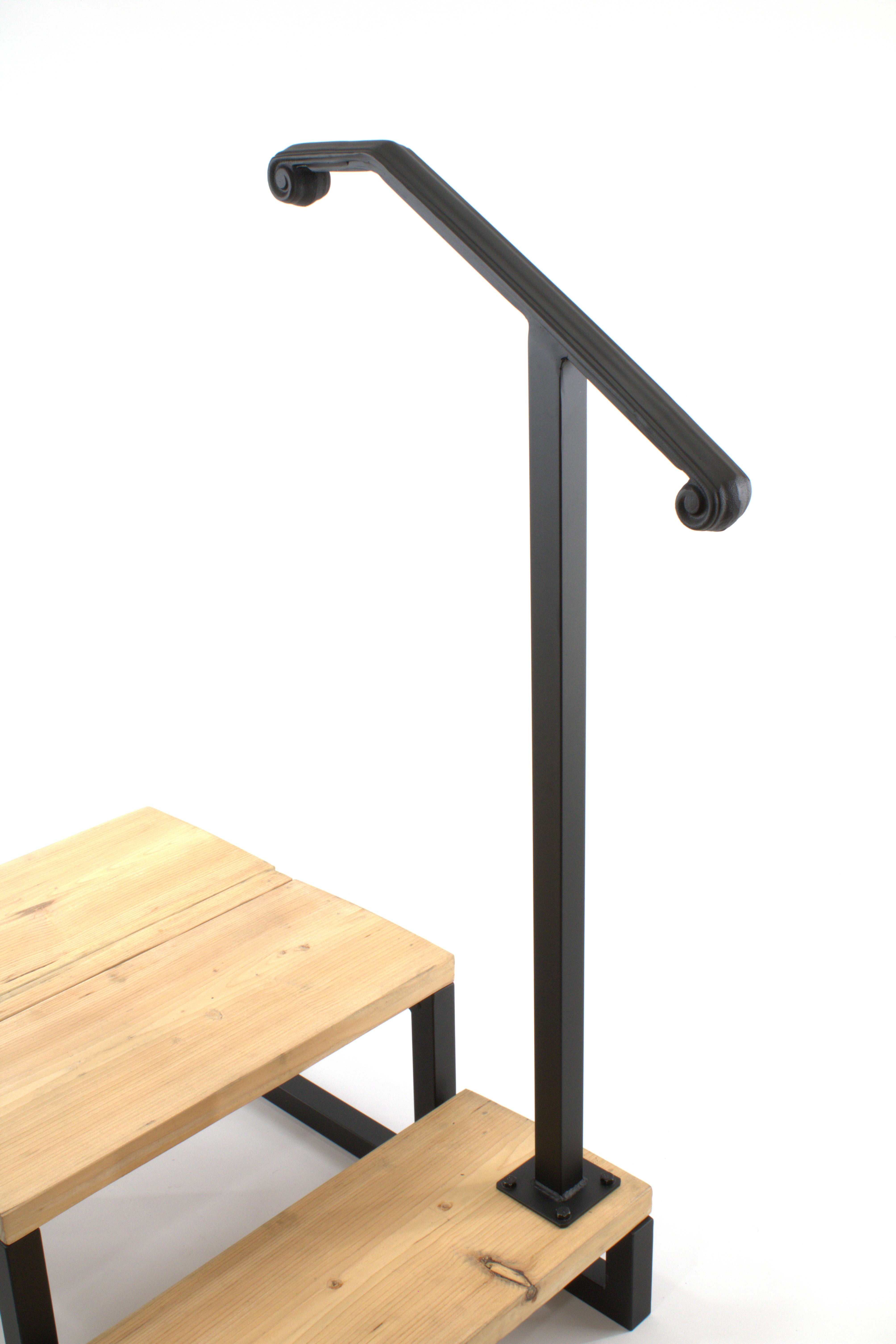 Handrail Installation service featuring a sleek black handrail on wooden stairs for safety and support.